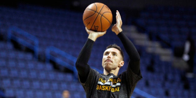 Los Angeles Lakers guard Steve Nash shoots during warmups for a preseason NBA basketball game against the Golden State Warriors, Sunday, Oct. 12, 2014, in Ontario, Calif. (AP Photo/Alex Gallardo)