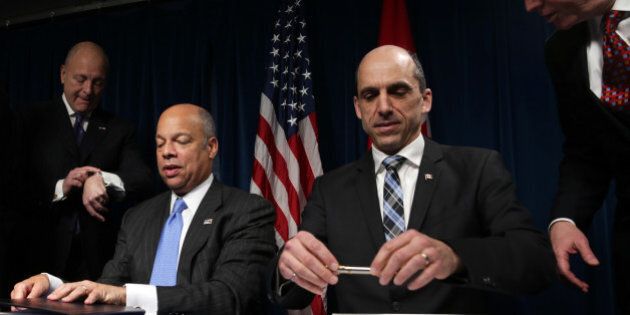 WASHINGTON, DC - MARCH 16: U.S. Secretary of Homeland Security Jeh Johnson (2nd L) and Canadian Minister of Public Safety and Emergency Preparedness Steven Blaney (3rd L) after posing for post-signing group photos during a signing ceremony of a pre-clearance agreement March 16, 2015 in Washington, DC. Secretary Johnson and Minister Blaney signed the Agreement on Land, Rail, Marine, and Air Transport Preclearance Between the Government of the United States of America and the Government of Canada, as part of the 'Beyond the Border' initiative. (Photo by Alex Wong/Getty Images)