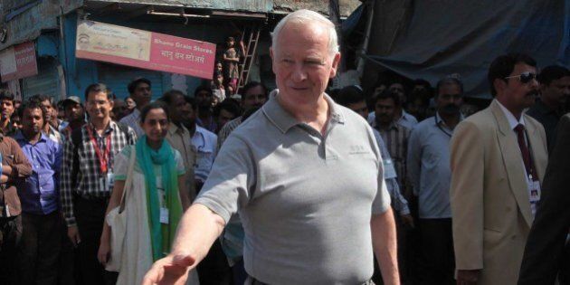 MUMBAI, INDIA - MARCH 1: David Johnston, Governor General of Canada visits Dharavi slums to see grassroots entrepreneurship in informal sectors on March 1, 2014 in Mumbai, India. Johnston said that Canada is looking forward to encourage young and innovative entrepreneurs from India who want to develop and market their ideas in Canada. Johnston is accompanied by his wife Sharon Johnston on his visit to India that is aimed at strengthening bilateral and economic ties. (Photo by Vijayanand Gupta/Hindustan Times via Getty Images)