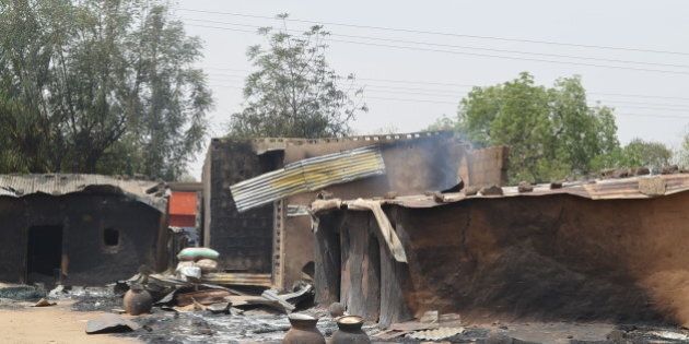 This photo shows razed homes in Mainok, outside Maiduguri, Borno State, Nigeria, on March 6, 2014. At least 74 people were killed in attacks on March 1, 2014 in villages near Maiduguri, blamed on Boko Haram militants, taking the overall death toll this year beyond 300, with no apparent end in sight to the carnage. Gunmen dressed in military fatigues and armed with powerful assault rifles, rocket-propelled grenades and explosives laid siege to the village of Mainok, killing 39. AFP PHOTO / STR (Photo credit should read STR/AFP/Getty Images)