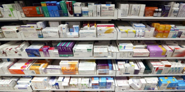 Boxes containing various pharmaceutical products are seen on display in the pharmacy department of a drugstore in London, U.K., on Friday, May 2, 2014. AstraZeneca Plc rejected Pfizer Inc.'s sweetened takeover proposal, saying the 63.1 billion-pound ($106.5 billion) offer fails to recognize the value of the promising experimental medicines under development by the U.K.'s second-biggest drugmaker. Photographer: Chris Ratcliffe/Bloomberg via Getty Images