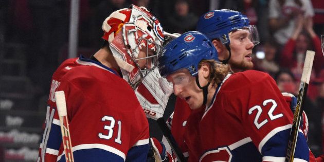 MONTREAL, QC - NOVEMBER 13: Dale Weise #22 of the Montreal Canadiens celebrates the victory with Carey Price #31 against the Boston Bruins in the NHL game at the Bell Centre on November 13, 2014 in Montreal, Quebec, Canada. (Photo by Francois Lacasse/NHLI via Getty Images)