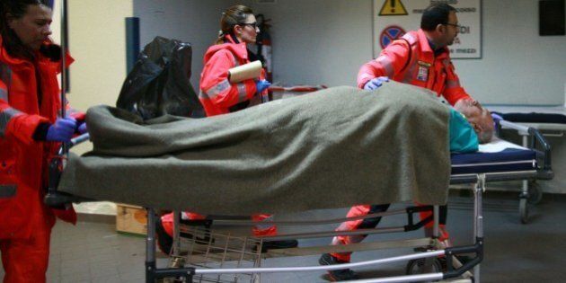 An injured passenger arrives at the Antonio Perrino hospital in Brindisi, southern Italy, rescued from the burning ferry 'Norman Atlantic' adrift off the coast of Albania, on December 28, 2014. Rescuers battled in the dark to save more than 300 trapped passengers from a burning Italian ferry as coastguards reported the first death in the high-seas drama. The Greek maritime ministry said 268 of the passengers were Greek, with the crew made up of 22 Italians and 34 Greeks. But the rest of the passengers were made up of 54 Turks, 44 Italians, 22 Albanians, 18 Germans, 10 Swiss, nine French, and Russian, Austrian, British and Dutch nationals. AFP PHOTO/CARLO HERMANN (Photo credit should read CARLO HERMANN/AFP/Getty Images)