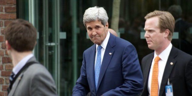 US Secretary of State John Kerry (C) is leaving Coburg Palais after his bilateral meeting with Iran's Foreign Minister Javad Zarif on the second straight day of talks over Tehran's nuclear program in Vienna, on July 14, 2014. US Secretary of State John Kerry pressed his Iranian counterpart Monday to make 'critical choices', six days before a deadline to cut a historic deal that would finally dispel fears about Tehran's nuclear drive. AFP PHOTO/JOE KLAMAR (Photo credit should read JOE KLAMAR/AFP/Getty Images)