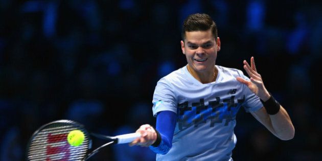 LONDON, ENGLAND - NOVEMBER 11: Milos Raonic of Canada plays a forehand in the round robin singles match against Andy Murray of Great Britain on day three of the Barclays ATP World Tour Finals at the O2 Arena on November 11, 2014 in London, England (Photo by Clive Brunskill/Getty Images)