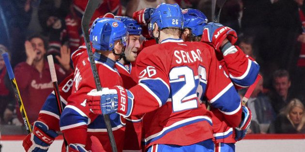 MONTREAL, QC - DECEMBER 20: Brandon Prust #8 of the Montreal Canadiens celebrates with teammates after scoring a goal against the Ottawa Senators in the NHL game at the Bell Centre on December 20, 2014 in Montreal, Quebec, Canada. (Photo by Francois Lacasse/NHLI via Getty Images)