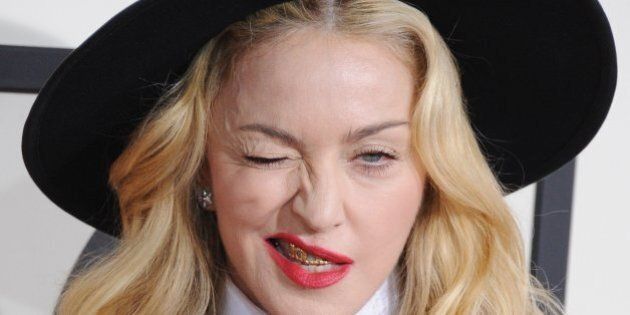 LOS ANGELES, CA - JANUARY 26: Singer Madonna arrives at the 56th GRAMMY Awards at Staples Center on January 26, 2014 in Los Angeles, California. (Photo by Jon Kopaloff/FilmMagic)
