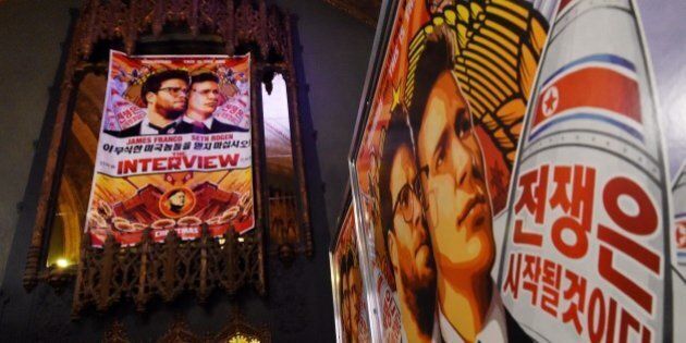 Movie posters for the premiere of the film 'The Interview' at The Theatre at Ace Hotel in Los Angeles, California on December 11, 2014. The film, starring US actors Seth Rogen and James Franco, is a comedy about a CIA plot to assassinate its leader Kim Jong-Un, played by Randall Park. North Korea has vowed 'merciless retaliation' against what it calls a 'wanton act of terror' -- although it has denied involvement in a massive cyber attack on Sony Pictures, the studio behind the film. AFP PHOTO/STR (Photo credit should read -/AFP/Getty Images)