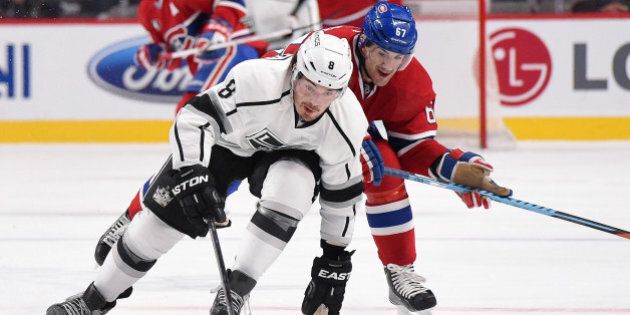 MONTREAL, QC - DECEMBER 12: Drew Doughty #8 of the Los Angeles Kings skates with the puck while being challenged by Max Pacioretty #67 of the Montreal Canadiens in the NHL game at the Bell Centre on December 12, 2014 in Montreal, Quebec, Canada. (Photo by Francois Lacasse/NHLI via Getty Images)