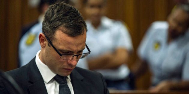 Oscar Pistorius sits in court in Pretoria, South Africa, Friday, Oct. 17, 2014, on the last day of sentencing procedures where the defense and prosecution will put their case for and against sentencing. Pistorius was found guilty last month of culpable homicide in the shooting death of his girlfriend Reeva Steenkamp on Valentine's Day in 2013. (AP Photo/Mujahid Safodien, Pool)