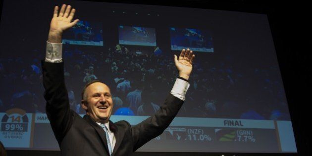 New Zealand Prime Minister John Key celebrates after winning the general election at the 2014 New Zealand National Party election event at Viaduct Event Center in Auckland on September 20, 2014. New Zealand's Prime Minister John Key said he was 'ecstatic' on September 20 after a crushing election win, securing his third term as leader of the South Pacific nation. AFP PHOTO / MARTY MELVILLE (Photo credit should read Marty Melville/AFP/Getty Images)