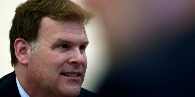 Canada's Foreign Minister John Baird smiles during talks with Serbian Prime Minister Aleksandar Vucic in Belgrade, Serbia, Monday, Sept. 1, 2014. Baird is on three day's official visit to Serbia. (AP Photo/Darko Vojinovic)