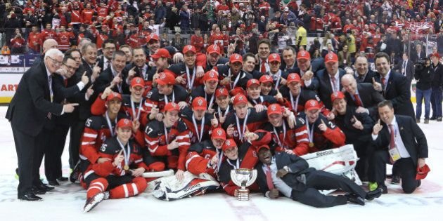 TORONTO, ON - JANUARY 5: Team Canada poses for a team photo after defeating Team Russia in the Gold medal game in the 2015 IIHF World Junior Hockey Championship at the Air Canada Centre on January 5, 2015 in Toronto, Ontario, Canada. Team Canada defeated Team Russia 5-4 to win the Gold medal. (Photo by Claus Andersen/Getty Images)