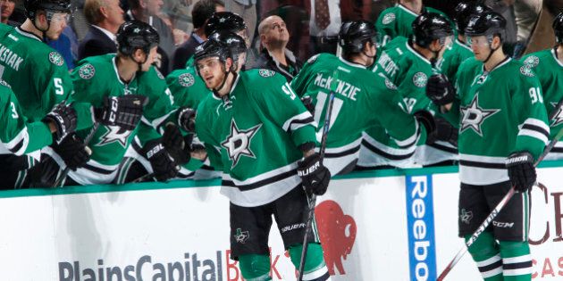DALLAS, TX - DECEMBER 6: Tyler Seguin #91 of the Dallas Stars high fives the line after scoring his twentieth goal of the season against the Montreal Canadiens at the American Airlines Center on December 6, 2014 in Dallas, Texas. (Photo by Glenn James/NHLI via Getty Images)