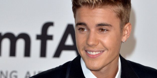 CAP D'ANTIBES, FRANCE - MAY 22: Justin Bieber attends amfAR's 21st Cinema Against AIDS Gala, Presented By WORLDVIEW, BOLD FILMS, And BVLGARI at the 67th Annual Cannes Film Festival on May 22, 2014 in Cap d'Antibes, France. (Photo by Anthony Harvey/FilmMagic)