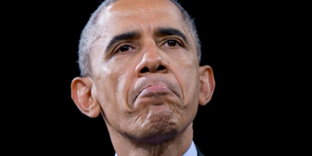 President Barack Obama pauses while speaking about immigration, Friday, Nov. 21, 2014, at Del Sol High School in Las Vegas. The president unveiled expansive executive actions on immigration Thursday night to spare nearly 5 million people in the U.S. illegally from deportation, setting off a fierce fight with Republicans over the limits of presidential powers. (AP Photo/Carolyn Kaster)