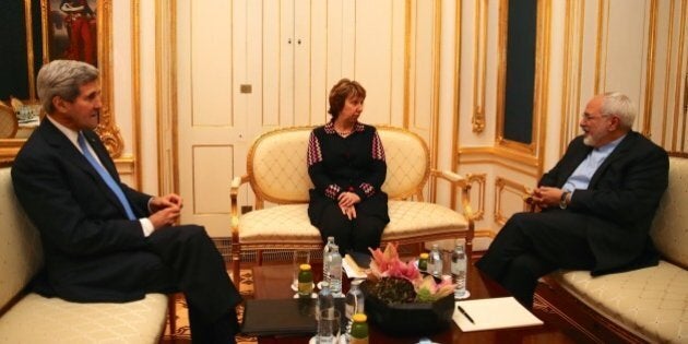 VIENNA, AUSTRIA - NOVEMBER 22: United States Secretary of State John Kerry (L) and former EU Foreign Policy Chief Catherine Ashton (C) meet with Iranian Foreign Minister Mohammad Javad Zarif (R) as a part of negotiations over Iran's nuclear program in Vienna, Austia on November 22, 2014. (Photo by Hasan Tosun/Anadolu Agency/Getty Images)