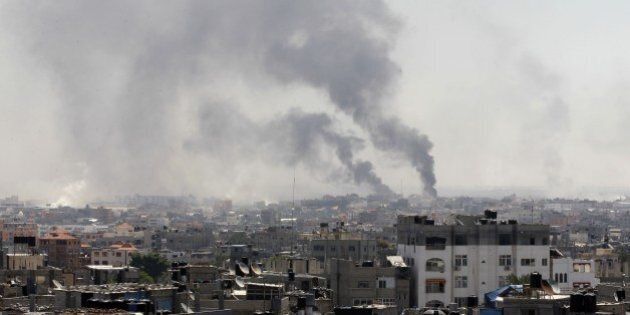 Smoke billows following an Israeli military strike east of Rafah in the southern Gaza Strip, on August 1, 2014. Israeli shelling killed eight people in southern Gaza, medics said, just hours after a 72-hour humanitarian ceasefire took effect. AFP PHOTO/ SAID KHATIB (Photo credit should read SAID KHATIB/AFP/Getty Images)