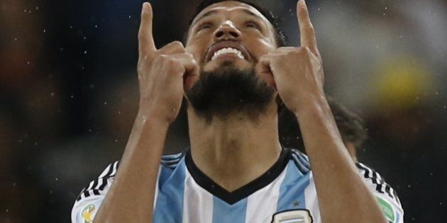 Argentina's defender Ezequiel Garay celebrates after scoring penalty shoot-outs following extra time during the semi-final football match between Netherlands and Argentina of the FIFA World Cup at The Corinthians Arena in Sao Paulo on July 9, 2014. AFP PHOTO / ADRIAN DENNIS (Photo credit should read ADRIAN DENNIS/AFP/Getty Images)