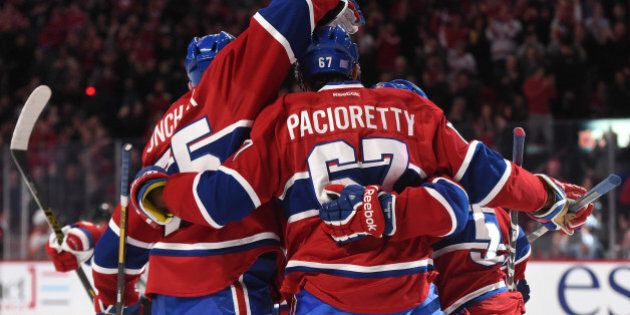 MONTREAL, QC - NOVEMBER 15: David Desharnais #51 of the Montreal Canadiens celebrates with Max Pacioretty #67 and Sergei Gonchar #55 after scoring a goal against the Philadelphia Flyers in the NHL game at the Bell Centre on November 15, 2014 in Montreal, Quebec, Canada. (Photo by Francois Lacasse/NHLI via Getty Images)