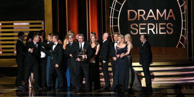 LOS ANGELES, CA - AUGUST 25: 66th ANNUAL PRIMETIME EMMY AWARDS -- Pictured: Writer/producer Vince Gilligan (c) and representatives of 'Breaking Bad' accept the Outstanding Drama Series award on stage during the 66th Annual Primetime Emmy Awards held at the Nokia Theater on August 25, 2014. (Photo by Mark Davis/NBC/NBC via Getty Images)