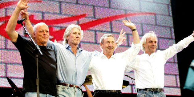 LONDON - JULY 02: (L to R) David Gilmour, Roger Waters, Nick Mason and Rick Wright from the band Pink Floyd on stage at 'Live 8 London' in Hyde Park on July 2, 2005 in London, England. The free concert is one of ten simultaneous international gigs including Philadelphia, Berlin, Rome, Paris, Barrie, Tokyo, Cornwall, Moscow and Johannesburg. The concerts precede the G8 summit (July 6-8) to raising awareness for MAKEpovertyHISTORY. (Photo by MJ Kim/Getty Images)