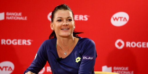 MONTREAL, QC - AUGUST 10: Agnieszka Radwanska of Poland speaks to the media after defeating Venus Williams of the USA during the women's finals match at Uniprix Stadium on August 10, 2014 in Montreal, Canada. (Photo by Streeter Lecka/Getty Images)