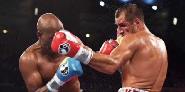 Bernard Hopkins of the US (L) fights against Sergey Kovalev of Russia during their IBF, WBA and WBO light heavyweight title bout at the Boardwalk Hall in Atlantic City, New Jersey, on November 8, 2014. Kovalev defeated Hopkins. AFP PHOTO/Jewel Samad (Photo credit should read JEWEL SAMAD/AFP/Getty Images)