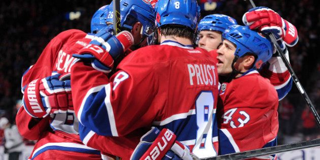 MONTREAL, QC - NOVEMBER 8: Lars Eller #81 of the Montreal Canadiens celebrates his second period goal with teammates during the NHL game against the Minnesota Wild at the Bell Centre on November 8, 2014 in Montreal, Quebec, Canada. (Photo by Richard Wolowicz/Getty Images)