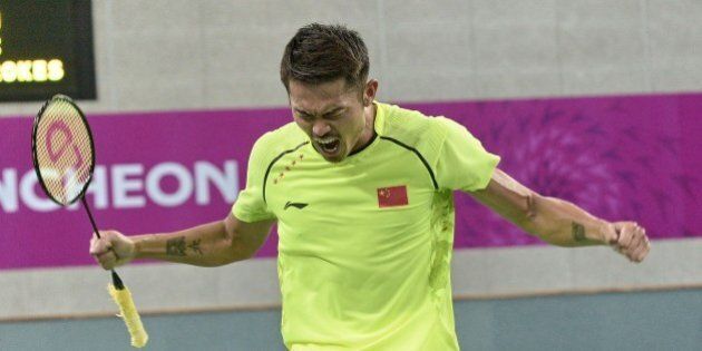 China's Lin Dan reacts after defeating Malaysia' Lee Chong Wei in the badminton men's single semi-finals at Gyeyang gymnasium during the 2014 Asian Games in Incheon on September 28, 2014. AFP PHOTO/ROSLAN RAHMAN (Photo credit should read ROSLAN RAHMAN/AFP/Getty Images)