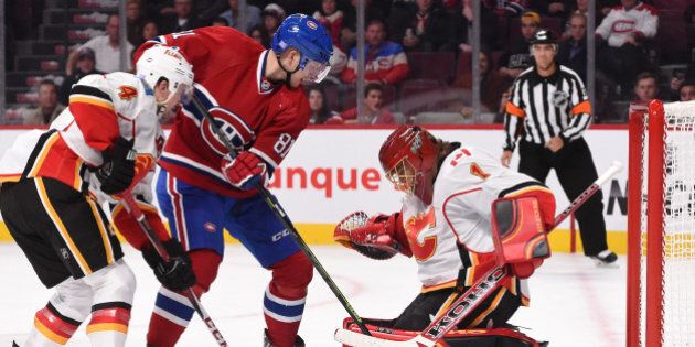 MONTREAL, QC - NOVEMBER 2: Lars Eller #81 of the Montreal Canadiens scores a goal against Jonas Hiller #1 of the Calgary Flames in the NHL game at the Bell Centre on November 2, 2014 in Montreal, Quebec, Canada. (Photo by Francois Lacasse/NHLI via Getty Images)