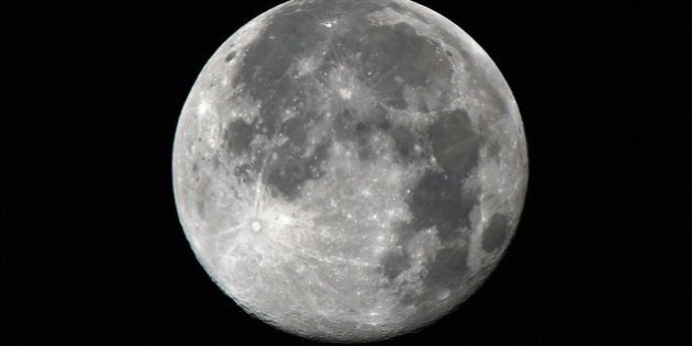 A view taken from the Moroccan capital Rabat on July 13, 2014 shows a full moon, with volcanic domes and impact craters. AFP PHOTO / FADEL SENNA (Photo credit should read FADEL SENNA/AFP/Getty Images)