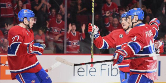 MONTREAL, QC - MARCH 21: Tomas Plekanec #14 of the Montreal Canadiens celebrates after scoring a goal against the San Jose Sharks in the NHL game at the Bell Centre on March 21, 2015 in Montreal, Quebec, Canada. (Photo by Francois Lacasse/NHLI via Getty Images)