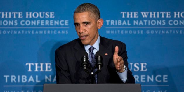 President Barack Obama speaks about the decision made by a grand jury in New York City to not indict a white police officer on criminal charges in the chokehold death of an unarmed black man in July, as he arrives at the 2014 White House Tribal Nations Conference at the Capital Hilton in Washington, Wednesday, Dec. 3, 2014. The decision not to indict Officer Daniel Pantaleo threatened to add to the tensions that have simmered in the city since the July 17 death ofÂ EricÂ Garner. (AP Photo/Carolyn Kaster)