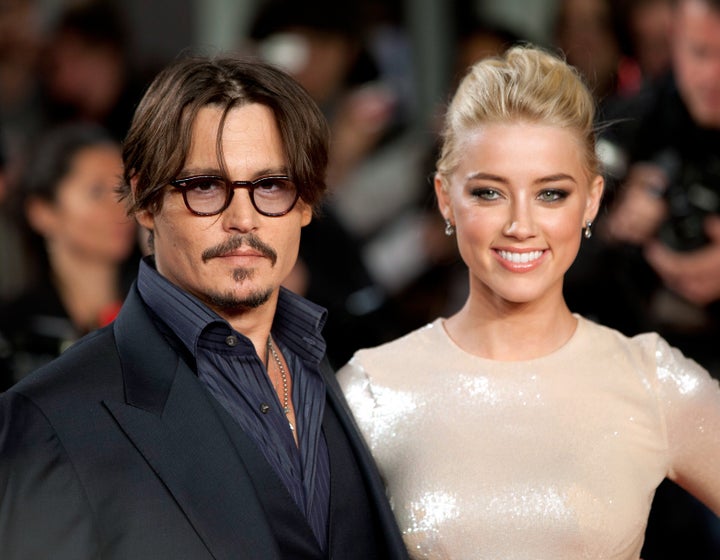 Johnny Depp and Amber Heard attend the premiere of "The Rum Diary" in London when they were still a couple.