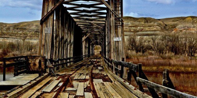 [UNVERIFIED CONTENT] Taken on May 9th 2009.This abandoned railway bridge is a testament to days past when the railway ushered cars to the the Atlas Coal Mine located near East Coulee in the Alberta Badlands south of Drumheller Canada.