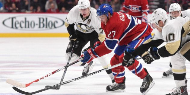 MONTREAL, QC - NOVEMBER 18: Alex Galchenyuk #27 of the Montreal Canadiens skates with the puck while being challenged by Christian Ehrhoff #10 and Evgeni Malkin #71 of the Pittsburgh Penguins in the NHL game at the Bell Centre on November 18, 2014 in Montreal, Quebec, Canada. (Photo by Francois Lacasse/NHLI via Getty Images)