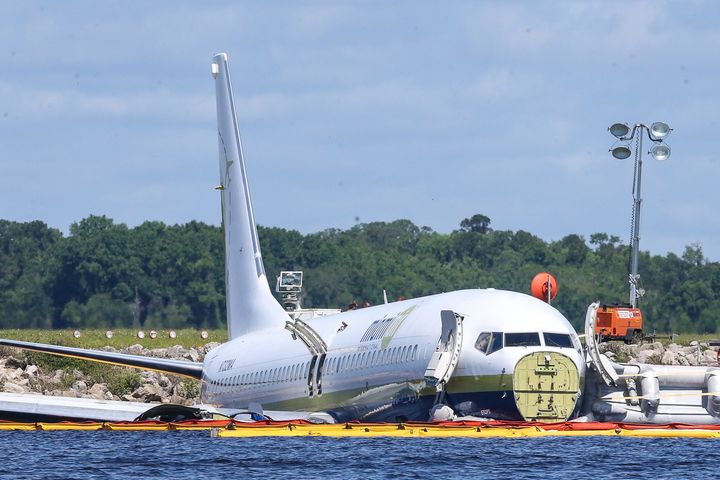 The charter plane sitting in the river on Saturday.