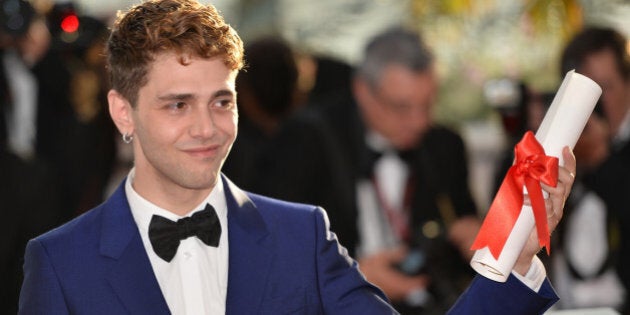 CANNES, FRANCE - MAY 24: Canadian director Xavier Dolan poses during the Award Winners photocall after he won the Best Director award for his movie 'Mr Turner' at the 67th Cannes Film Festival in Cannes, France on May 24, 2014. (Photo by Mustafa Yalcin/Anadolu Agency/Getty Images)