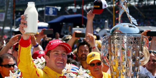 INDIANAPOLIS, IN - MAY 25: Ryan Hunter-Reay, driver of the #28 DHL Andretti Autosport Honda Dallara, celebrates in Victory Lane with milk after winning the 98th running of the Indianapolis 500 at Indianapolis Motorspeedway on May 25, 2014 in Indianapolis, Indiana. (Photo by Jonathan Ferrey/Getty Images)