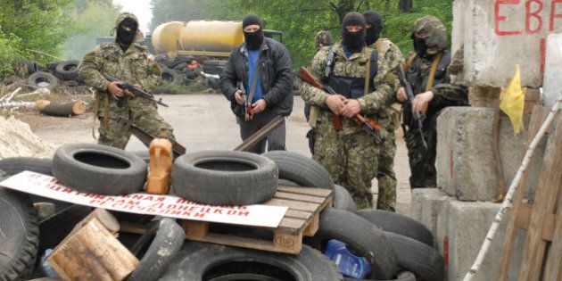 SLAVYANSK - UKRAINE - MAY 2: Ukrainian government forces have launched a military operation in the eastern city of Slavyansk, which was taken over by Pro-Russian rebels several weeks ago in Slavyansk, Ukraine on May 2, 2014. Pro-Russian groups were abandoning and setting fire to the barricades they had set in the outskirts of the city as Ukrainian forces moved in. (Photo by Bahtiyar Abdukerimov/Anadolu Agency/Getty Images)