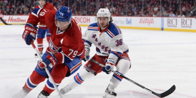 MONTREAL, QC - APRIL 12: Andrei Markov #79 of the Montreal Canadiens controls the puck followed by Mats Zuccarello #36 of the New York Rangers during the NHL game on April 12, 2014 at the Bell Centre in Montreal, Quebec, Canada. (Photo by Francois Lacasse/NHLI via Getty Images)
