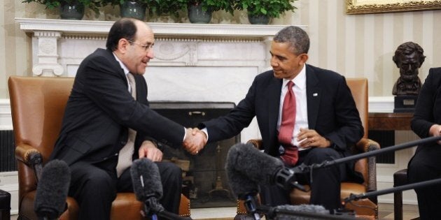 WASHINGTON, DC - NOVEMBER 01: Iraqi Prime Minister Nouri Al-Maliki (L) shakes hands with U.S. President...