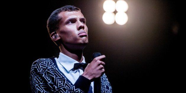 Belgian singer Stromae performs during the 'Lowlands' music festival in Biddinghuizen, on August 16, 2014. The annual event, one of the biggest music festival in The Netherlands, runs until August 17, 2014. AFP PHOTO/ANP/ FERDY DAMMAN netherlands out (Photo credit should read Ferdy Damman/AFP/Getty Images)