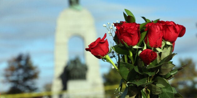 OTTAWA, ON- OCTOBER 23 - Flowers are placed on the barrier near the War Memorial in the aftermath of a shooting in Ottawa, where a soldier murdered at the War Memorial and a gun battle in Parliament killed the alleged gun man. in Ottawa. October 23, 2014. (Steve Russell/Toronto Star via Getty Images)