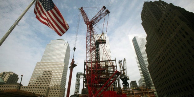 NEW YORK - AUGUST 12: Construction workers install the first of 24 large steel columns at the core of One World Trade Center August 12, 2009 in New York City. The perimeter columns, which are approximately 60-foot long and 70 tons, will allow the initial floors of the tower to be constructed and are the largest to be used to date on the tower. (Photo by Mario Tama/Getty Images)