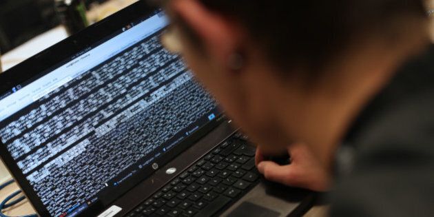 A student from an engineering school attends, on Meudon, west of Paris, overnight on March 16, 2013, the first edition of the Steria Hacking Challenge. AFP PHOTO / THOMAS SAMSON (Photo credit should read THOMAS SAMSON/AFP/Getty Images)