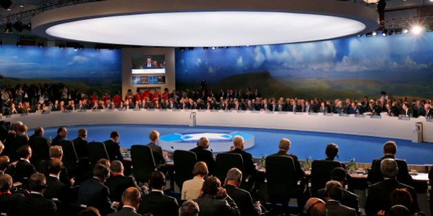 NATO Secretary-General Anders Fogh Rasmussen, seen on screen, speaks as President Barack Obama and NATO leaders meet regarding Afghanistan, Thursday, Sept. 4, 2014, at the NATO summit at Celtic Manor in Newport, Wales. (AP Photo/Charles Dharapak)