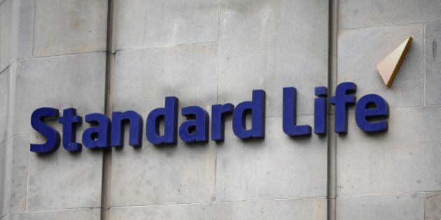 A Standard Life logo sits on a wall outside Standard Life House, the headquarters of Standard Life Plc, in Edinburgh, U.K., on Saturday, Aug. 9, 2014. Scottish First Minister Alex Salmond said nothing will stop an independent Scotland from using the pound and dismissed U.K. opposition to a currency union ahead of a vote on the country's future. Photographer: Simon Dawson/Bloomberg via Getty Images