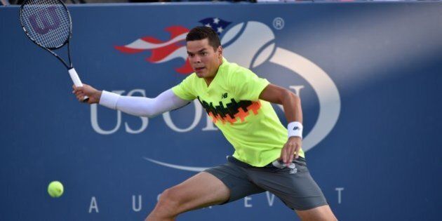 Milos Raonic of Canada returns a shot to Peter Gojowczyk of Germany during their 2014 US Open men's singles match at the USTA Billie Jean King National Tennis Center August 28, 2014 in New York. AFP PHOTO/Stan HONDA (Photo credit should read STAN HONDA/AFP/Getty Images)